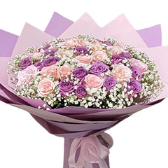 Purple and pink rose bouquet with baby’s breath for flower delivery
