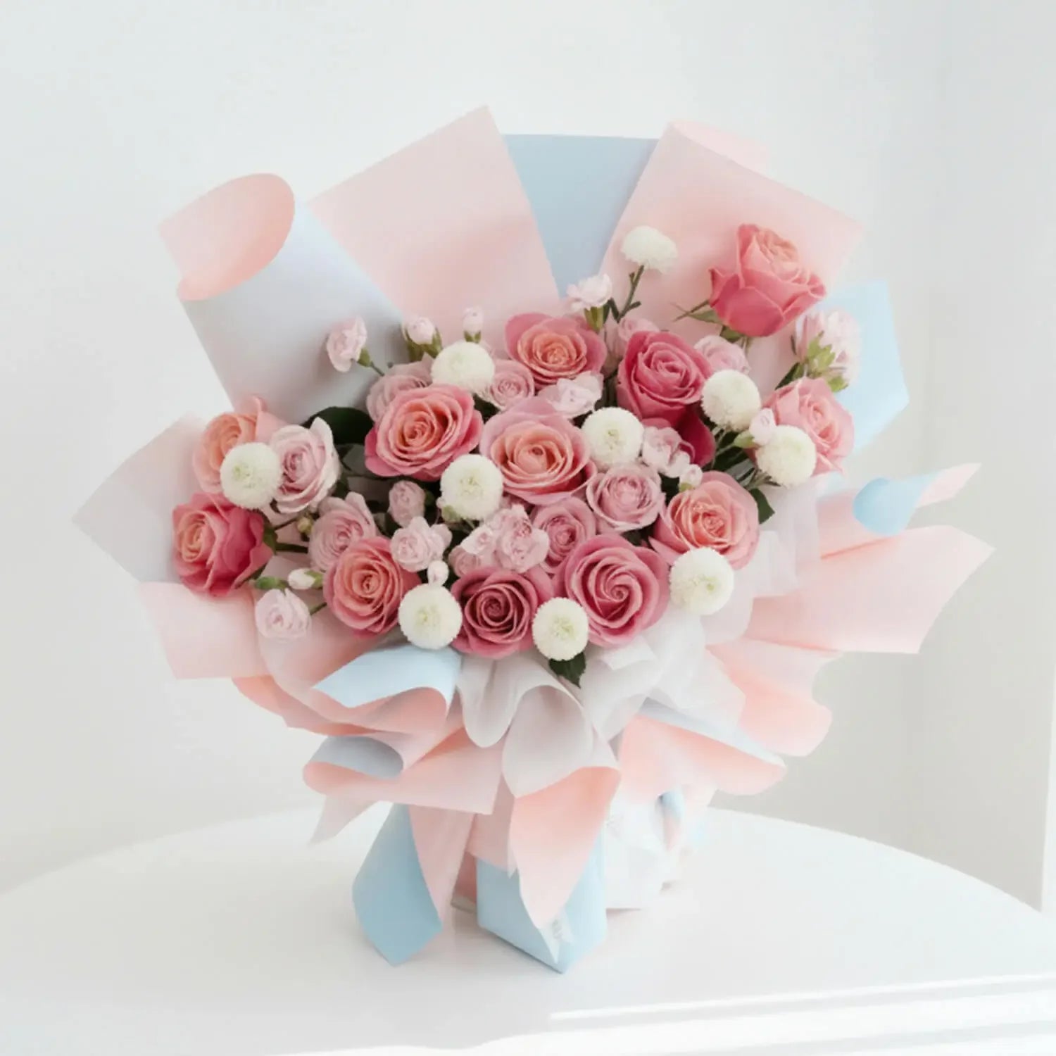 Elegant pink rose bouquet with white flowers for flower delivery in Singapore
