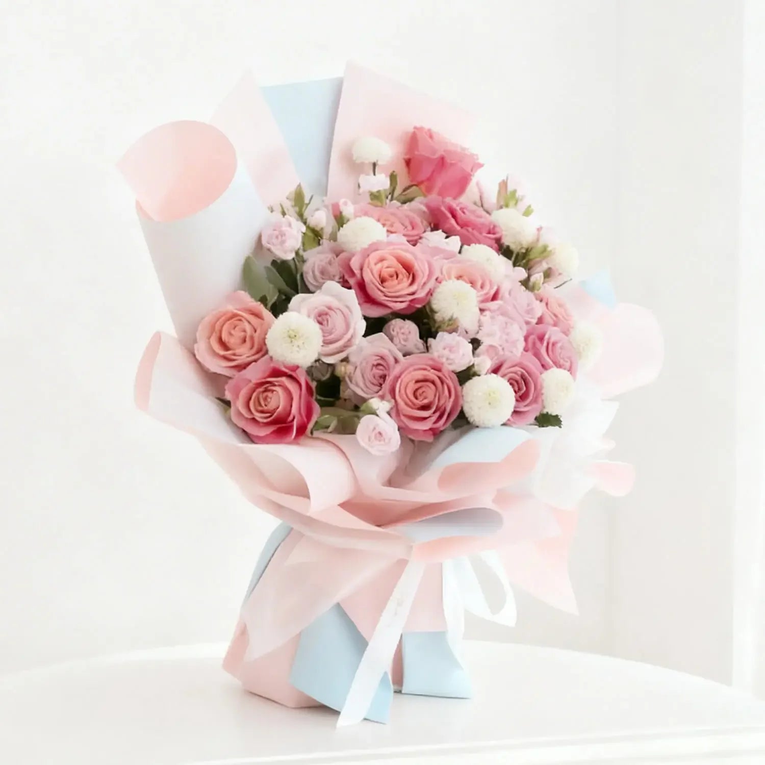 Fresh pink rose bouquet with white accents, ideal for flower delivery in Singapore