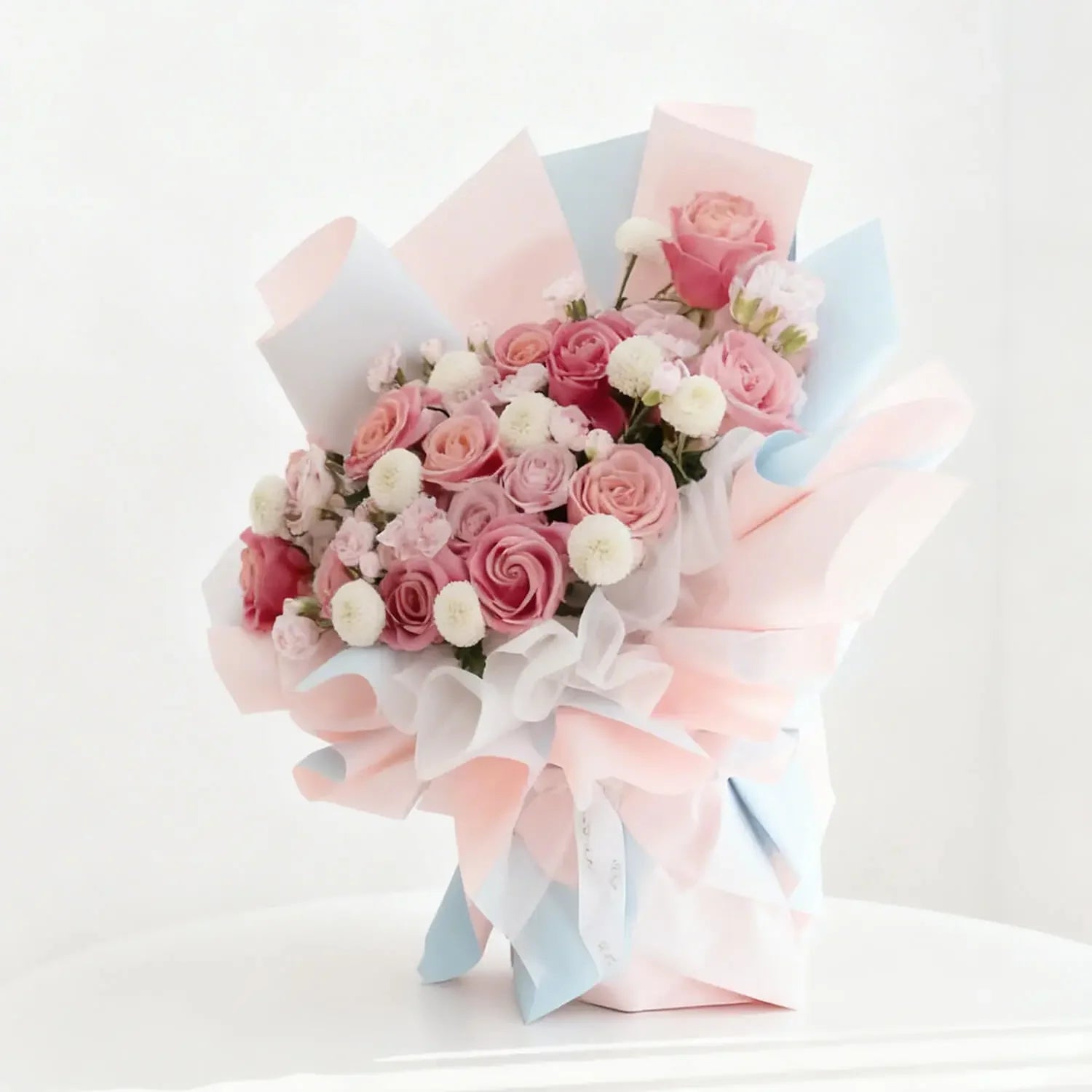 Elegant pink rose bouquet with white accents, perfect for flower delivery in Singapore