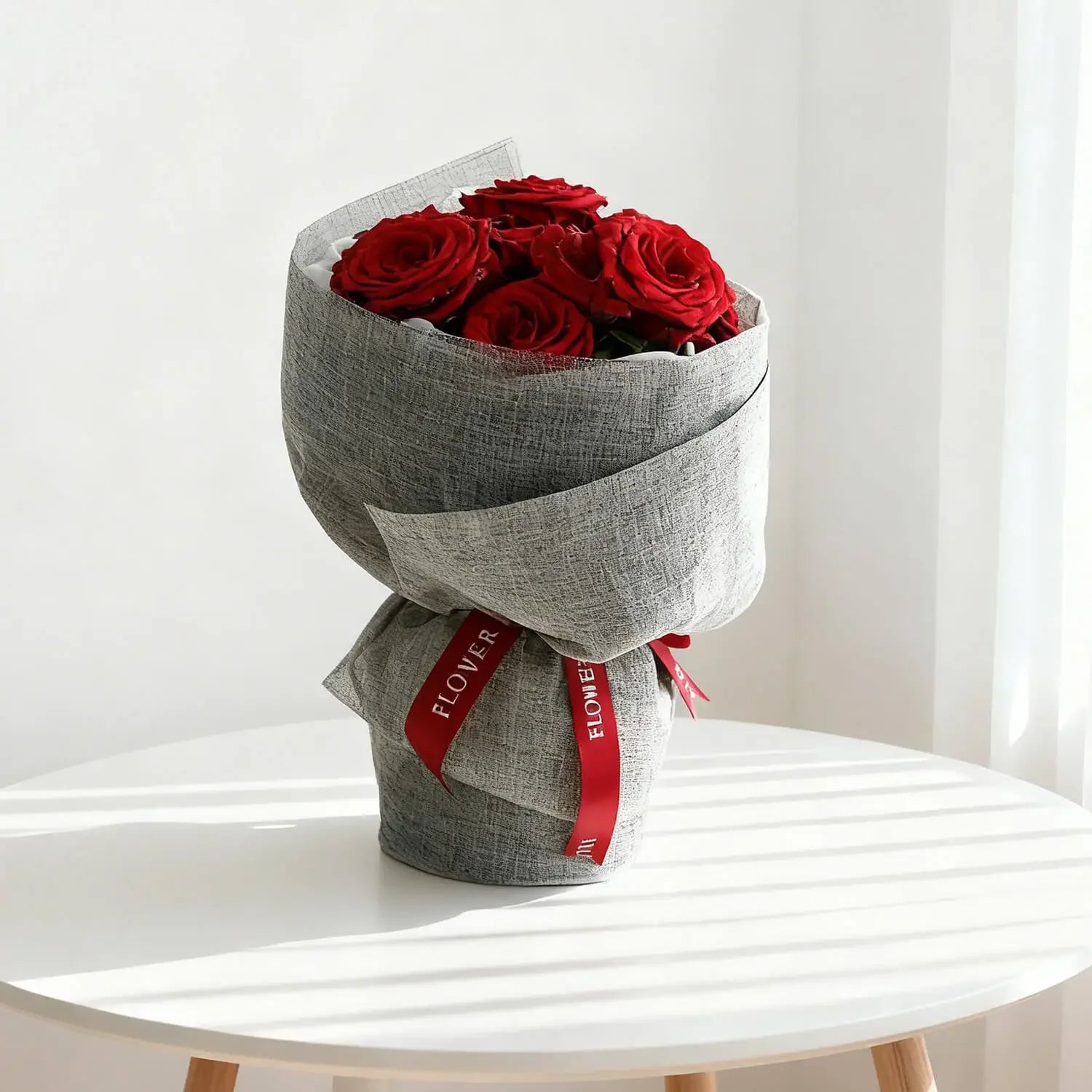 Bouquet of red roses in grey wrapping, perfect for flower delivery in Singapore