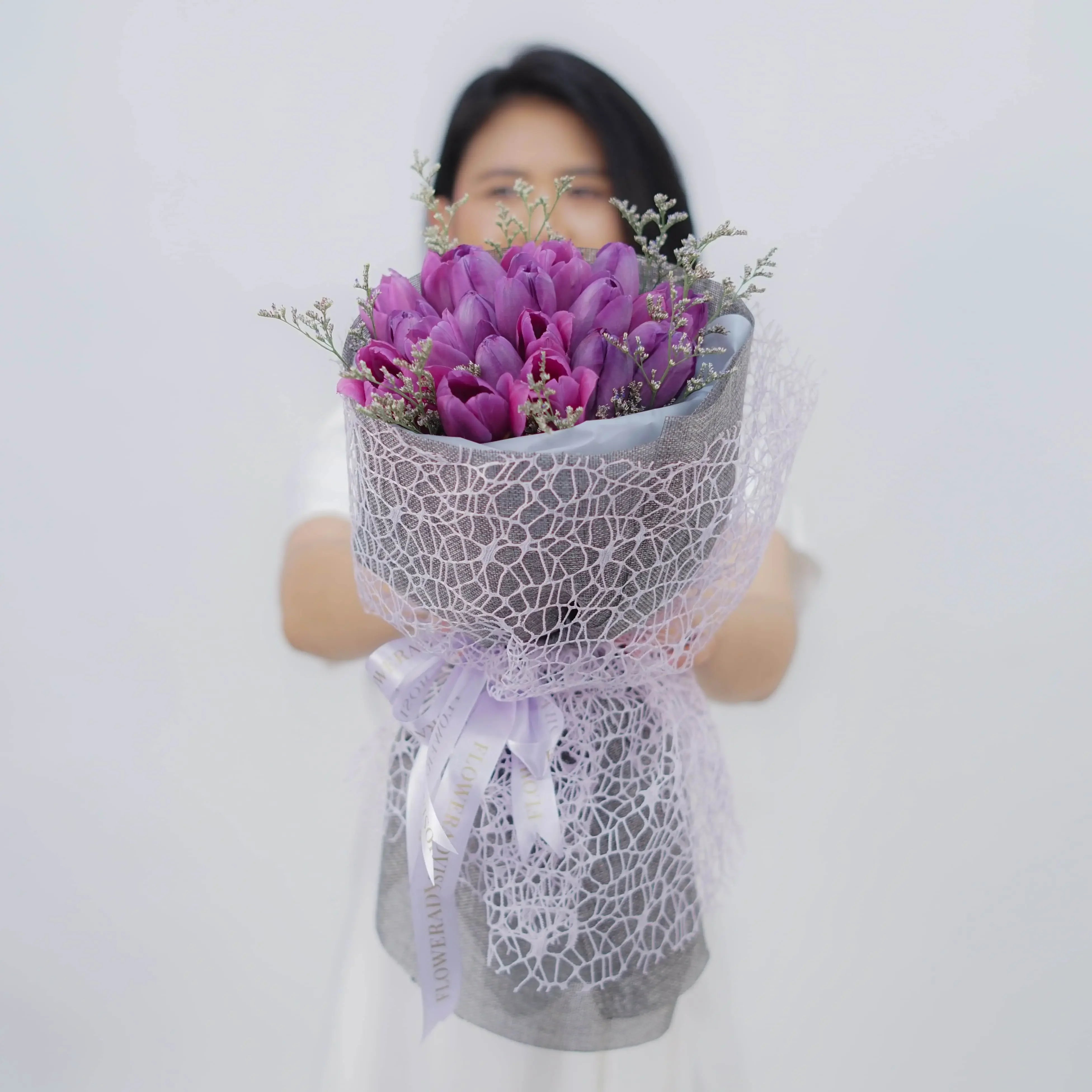 Purple tulip bouquet with lace wrapping for flower delivery in Singapore