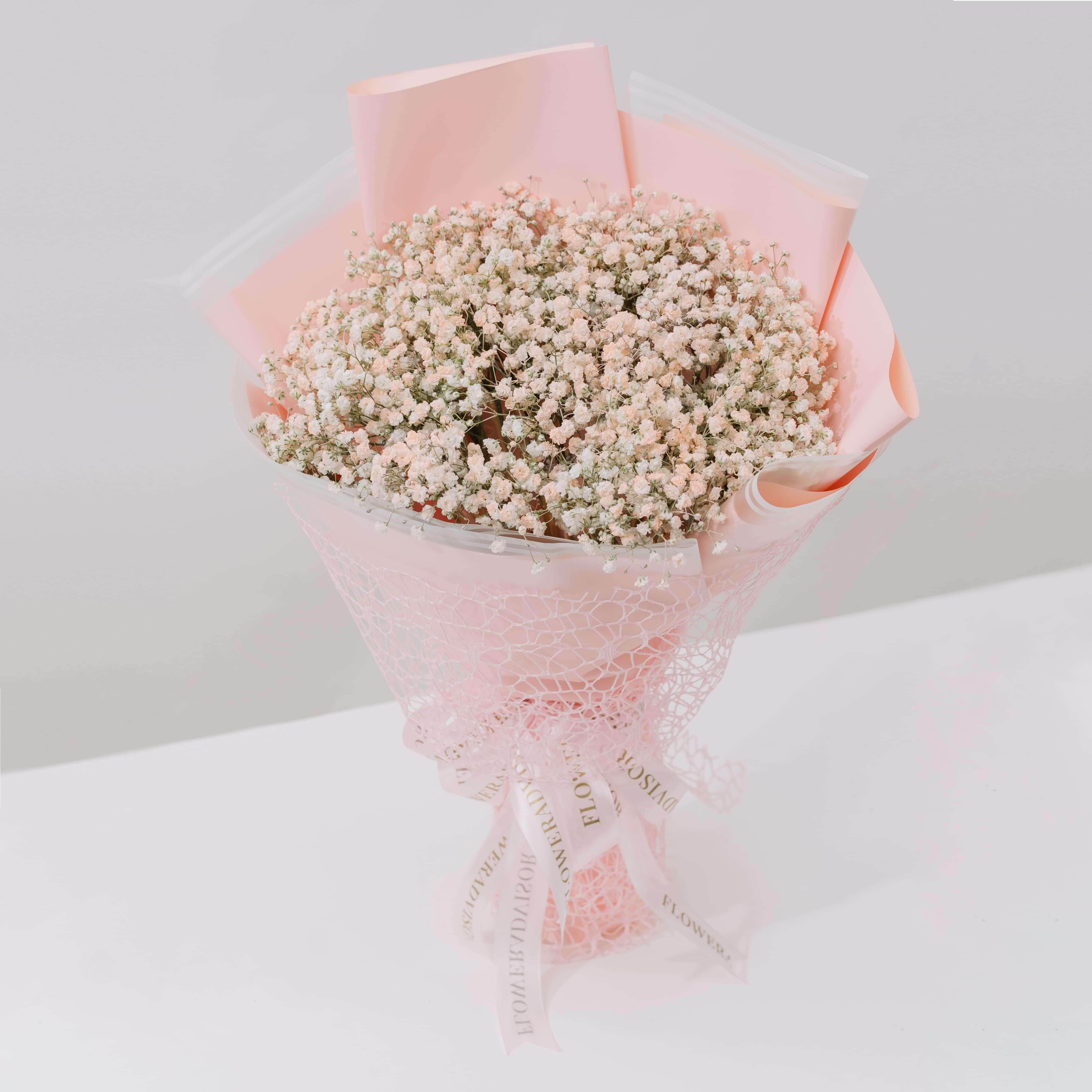 Pink baby's breath bouquet in pastel wrapping, ideal for flower delivery in Singapore