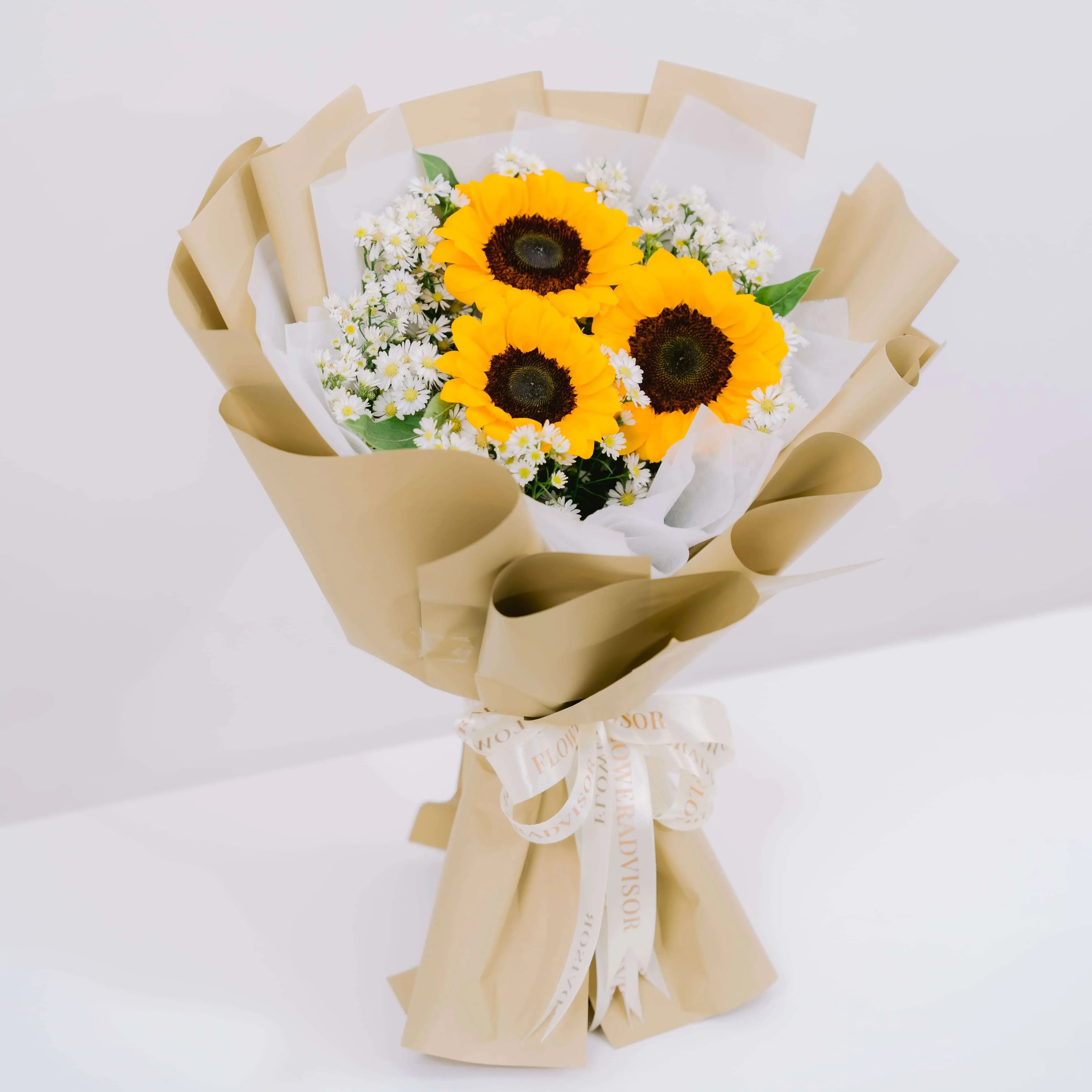 Hand-tied sunflower bouquet with white filler flowers, ideal for flower delivery in Singapore