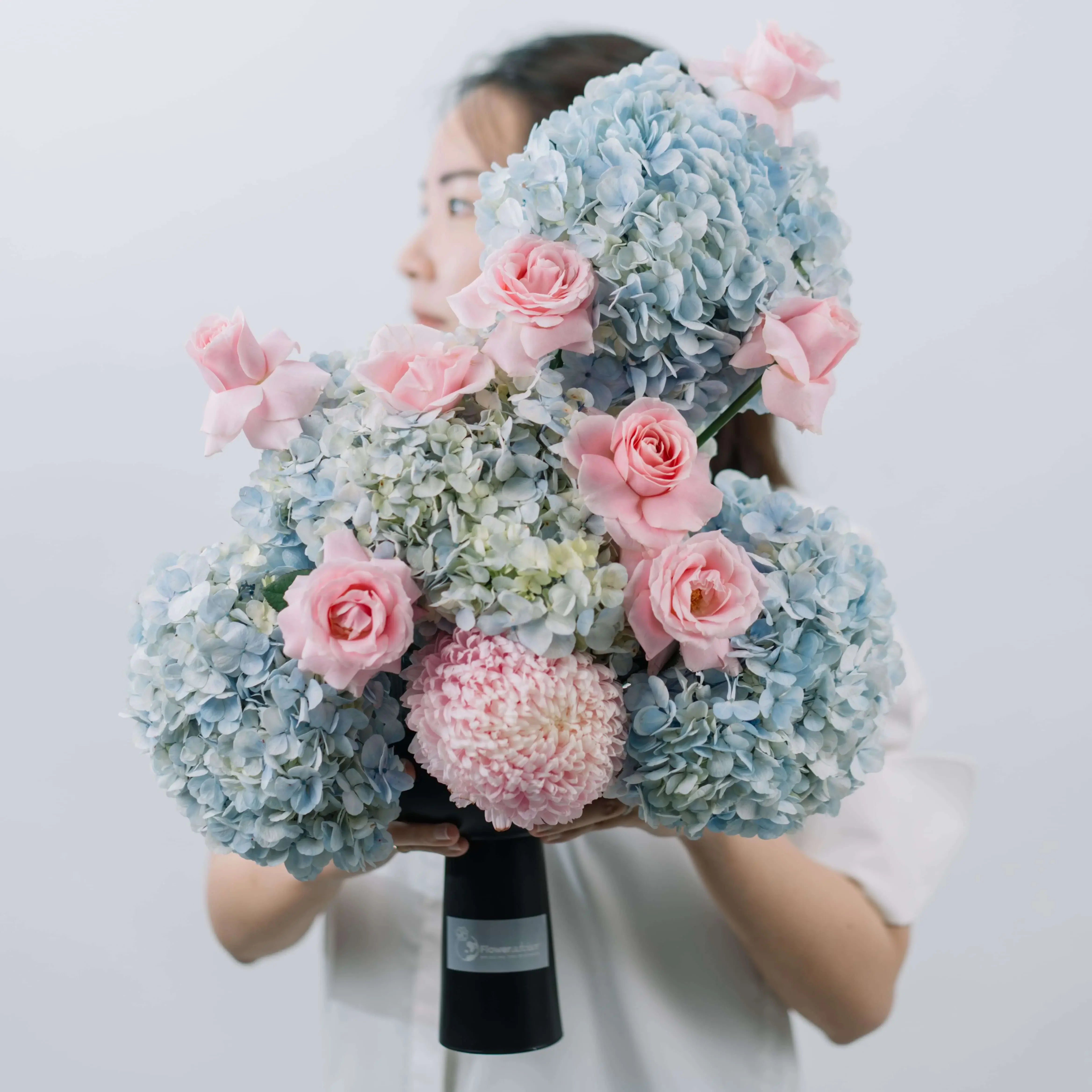 Bouquet with blue hydrangeas and pink roses for flower delivery in Singapore