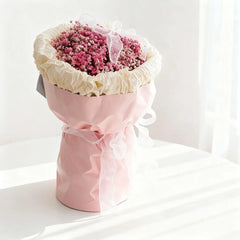 Pink baby's breath bouquet in pastel wrapping with ribbon, perfect for flower delivery Singapore