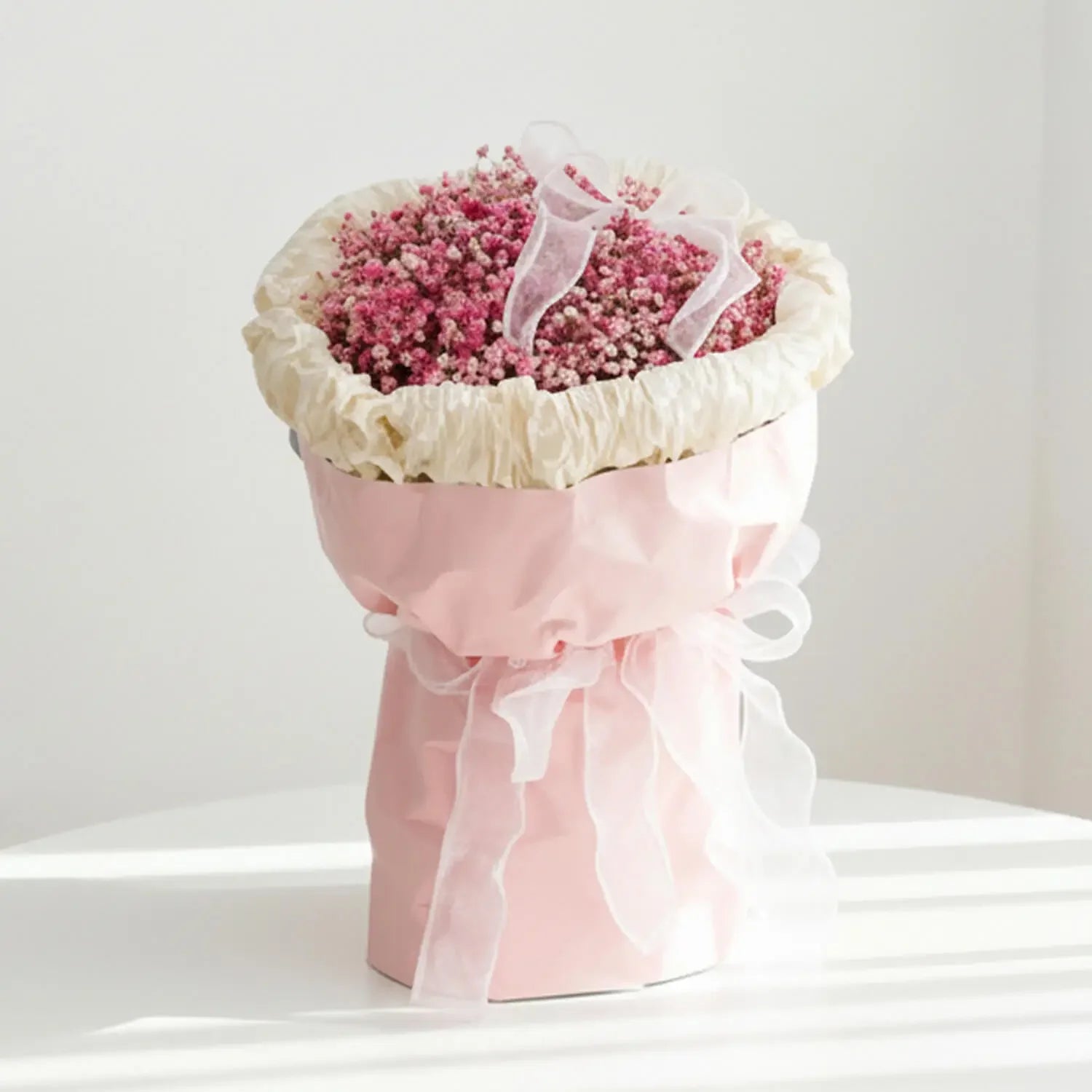 Pink baby’s breath bouquet in pastel wrapping, ideal for flower delivery in Singapore