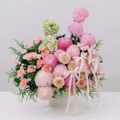 Soft pink peony and mum bouquet with ribbons for flower delivery in Singapore