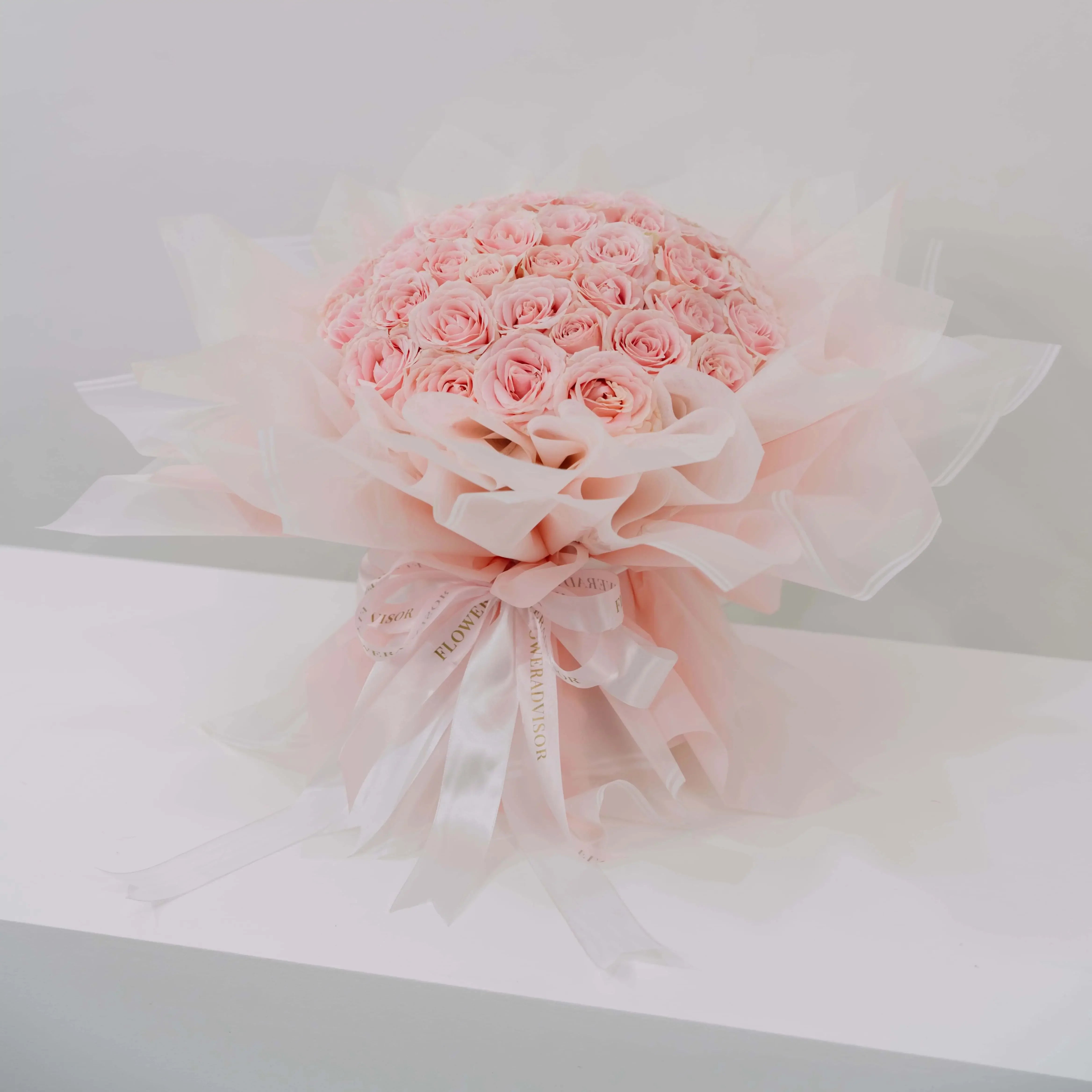 Large bouquet of 50 pink roses in soft wrapping, perfect for flower delivery in Singapore