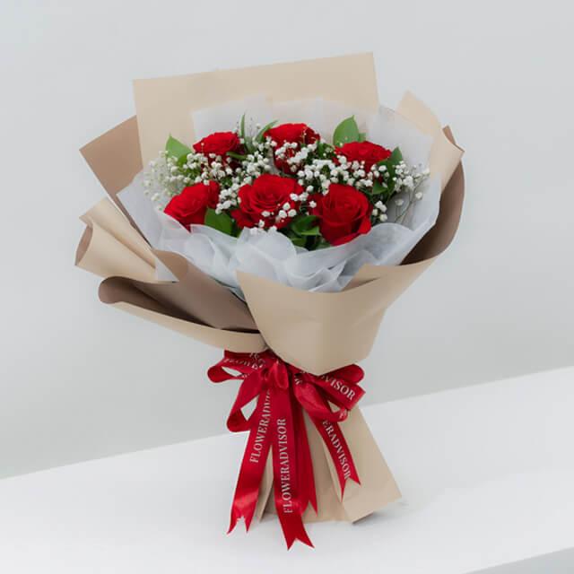 Red roses bouquet with baby’s breath, ideal for flower delivery in Singapore