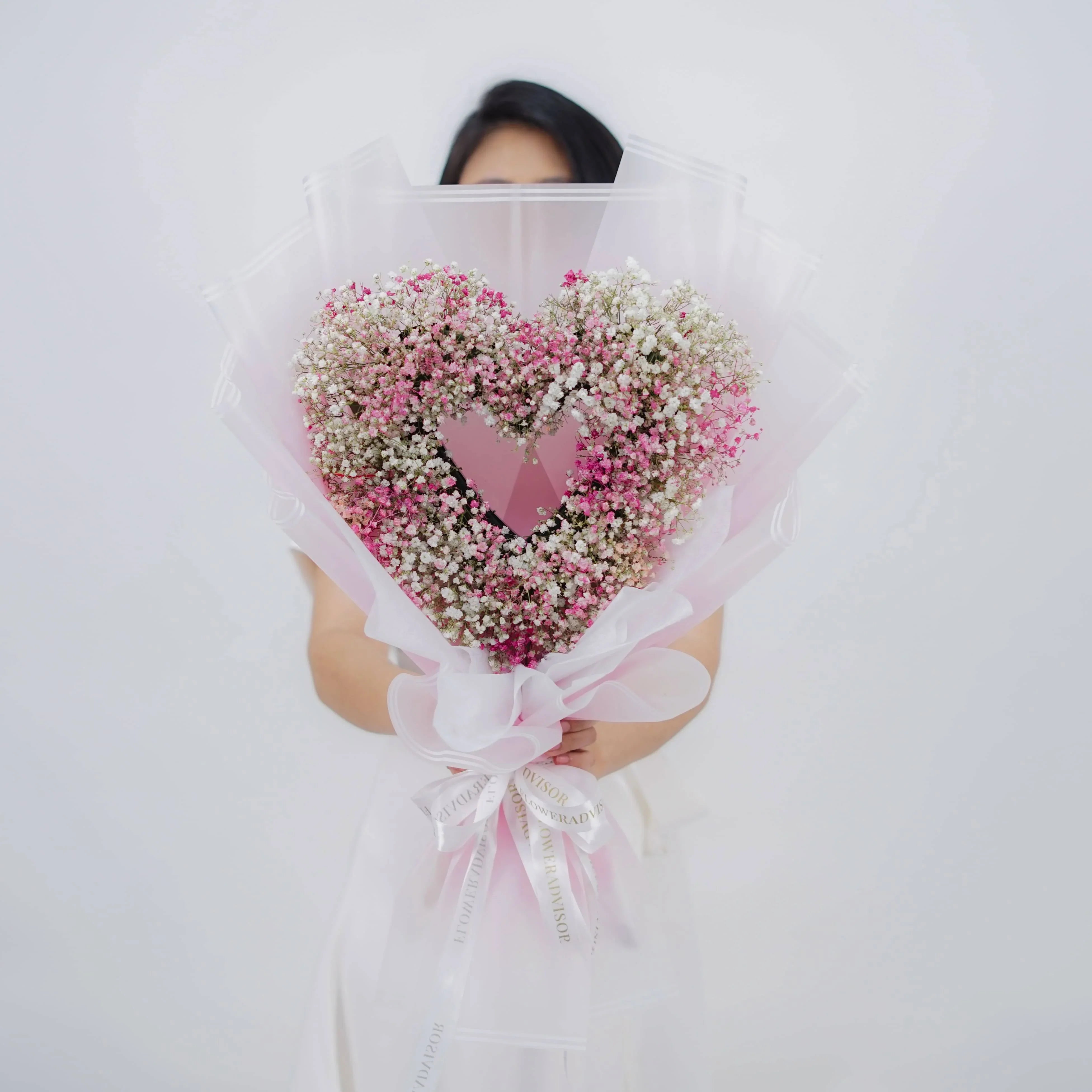 Heart-shaped baby’s breath bouquet in pink and white, ideal for flower delivery gifts