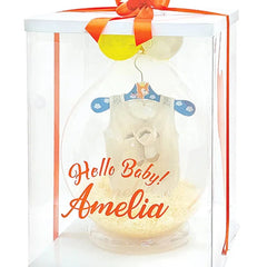 Newborn gift box with baby romper, soft toy, and decorative balloon for flower delivery