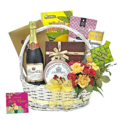 Hari Raya flower hamper with yellow roses, red carnations, sparkling juice, snacks, and festive card, ideal for flower delivery Singapore