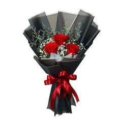 Elegant red rose bouquet with black wrapping, perfect for flower delivery in Singapore