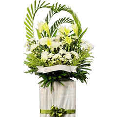 White lily and yellow flower arrangement on tall stand, ideal for flower delivery in Singapore