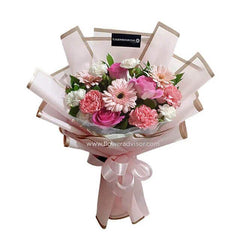 Pink and white flower bouquet with ribbon, perfect for flower delivery in Singapore